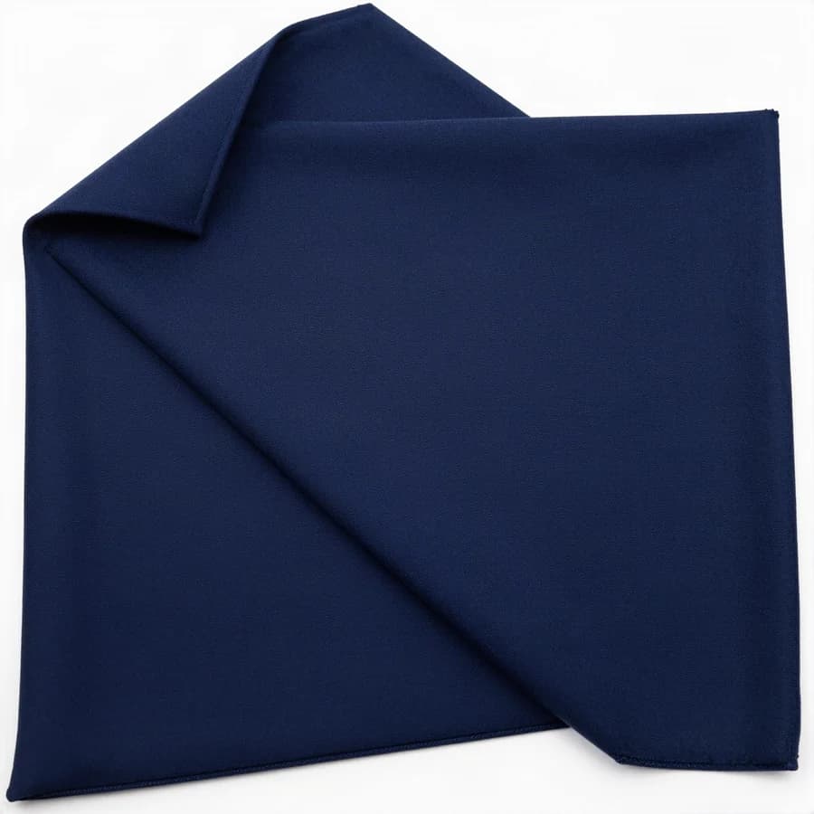 A folded square of navy suiting fabric