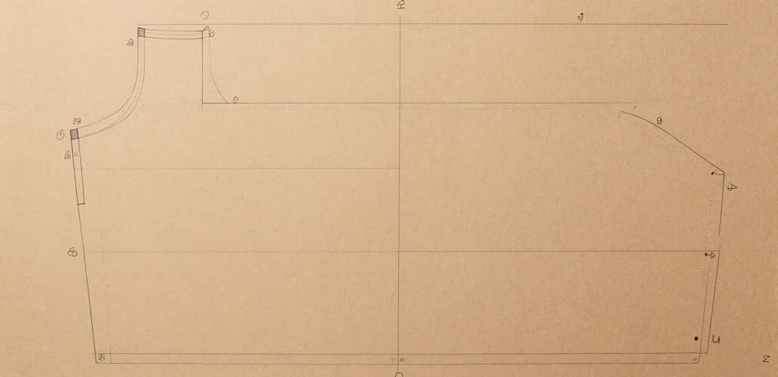 Technical suit-pattern blueprint with chalk marks